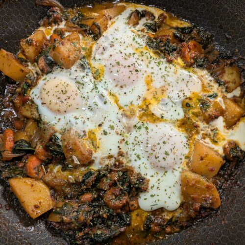 breakfast potato egg hash in skillet
