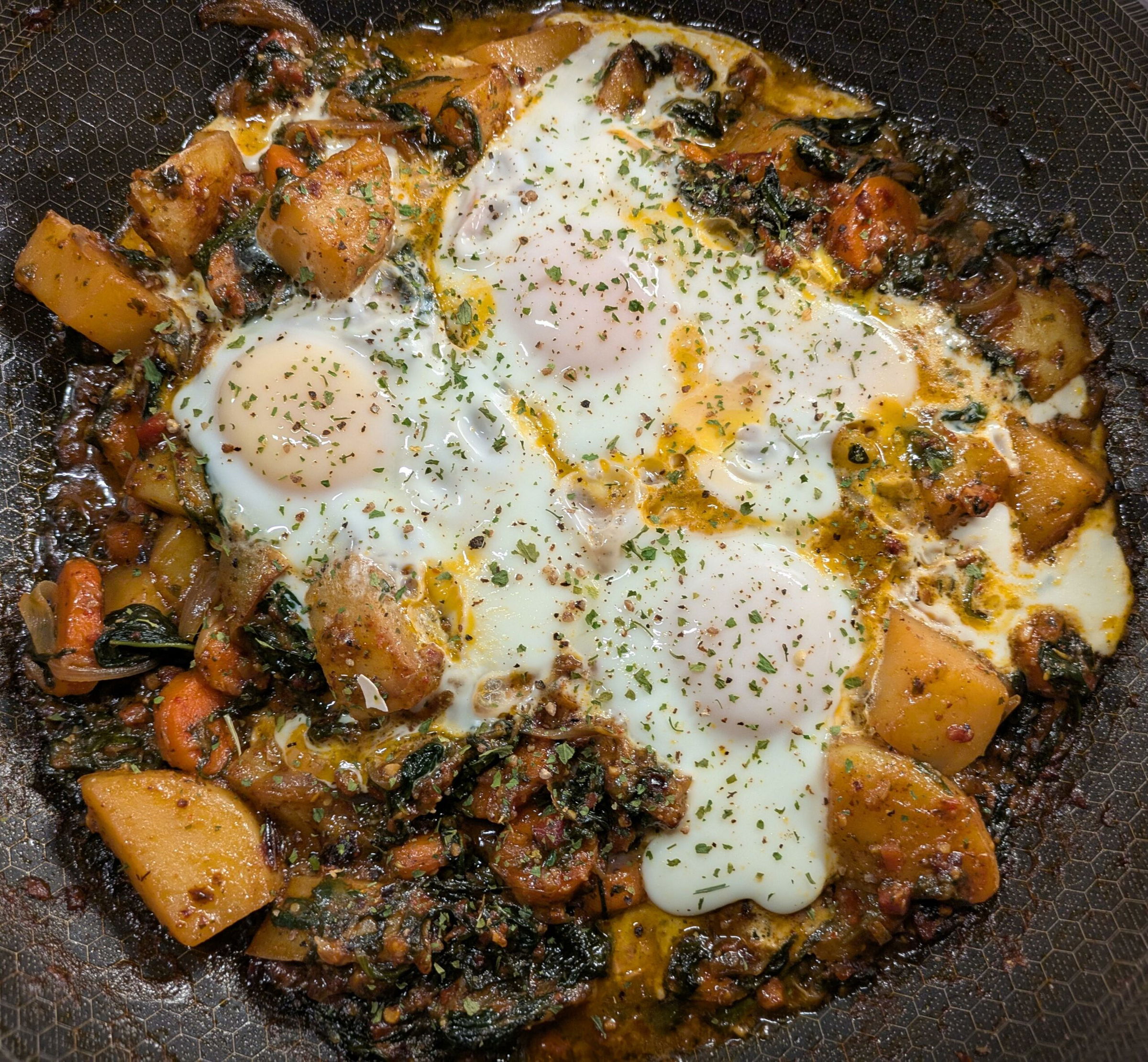 breakfast potato egg hash in skillet