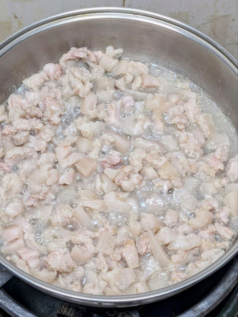 rendering pork fat in a pan